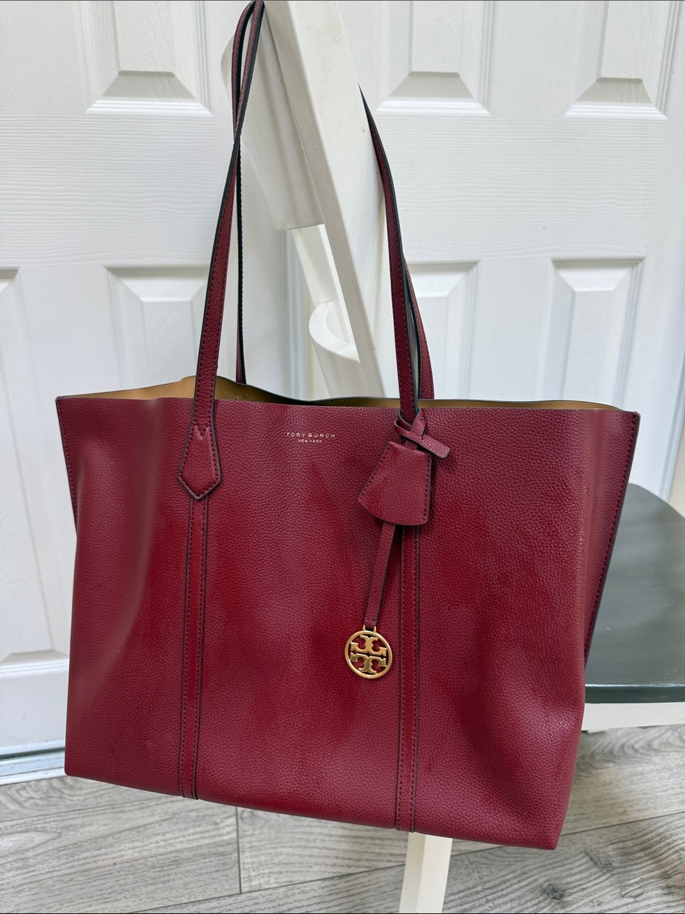 Tory Burch Wine Red Pebbled Leather Tote with Gold Logo Charm